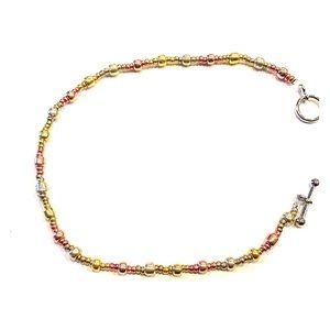 Gold, bronze, and silver necklace